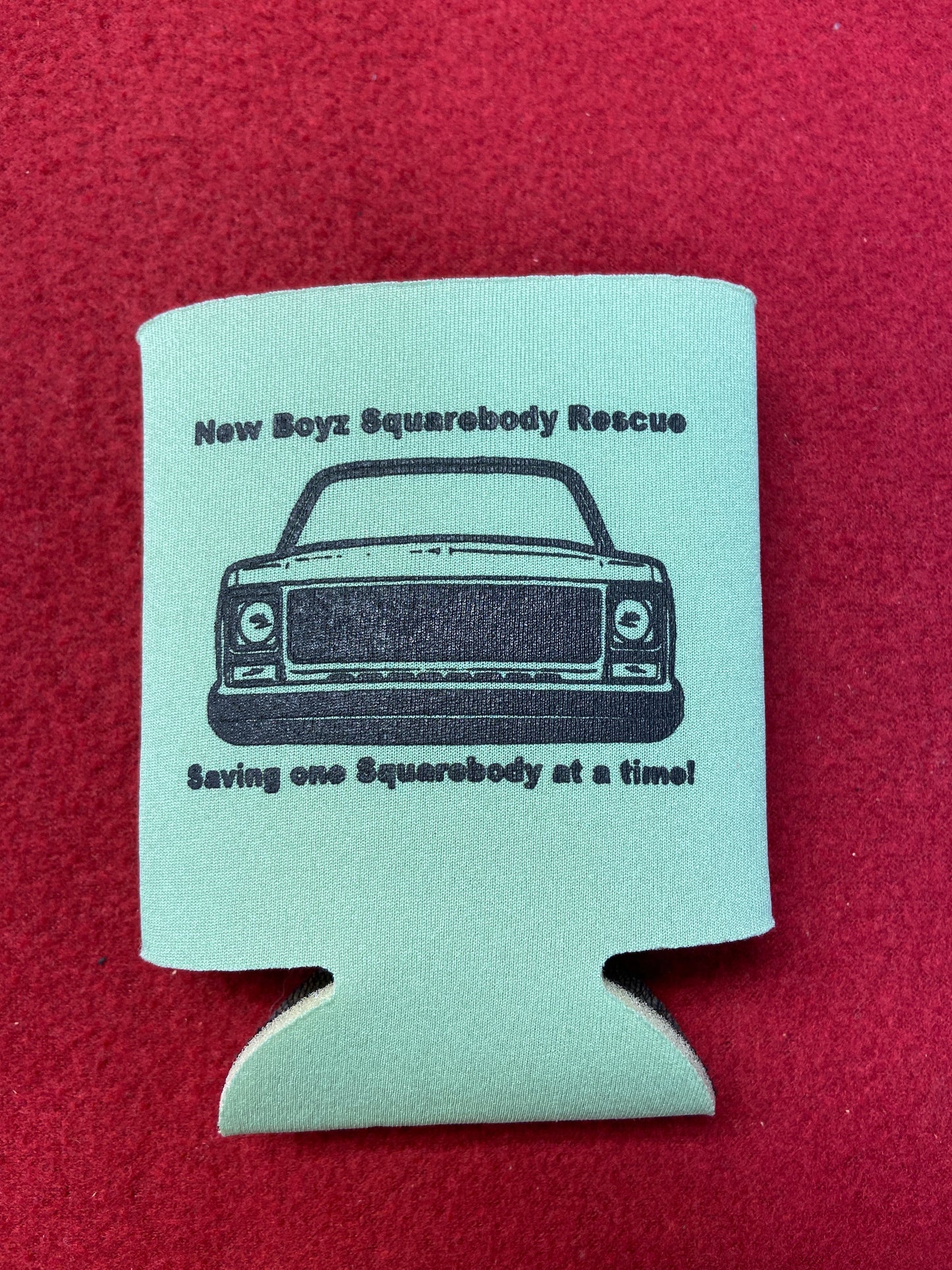Koozie green with black logo