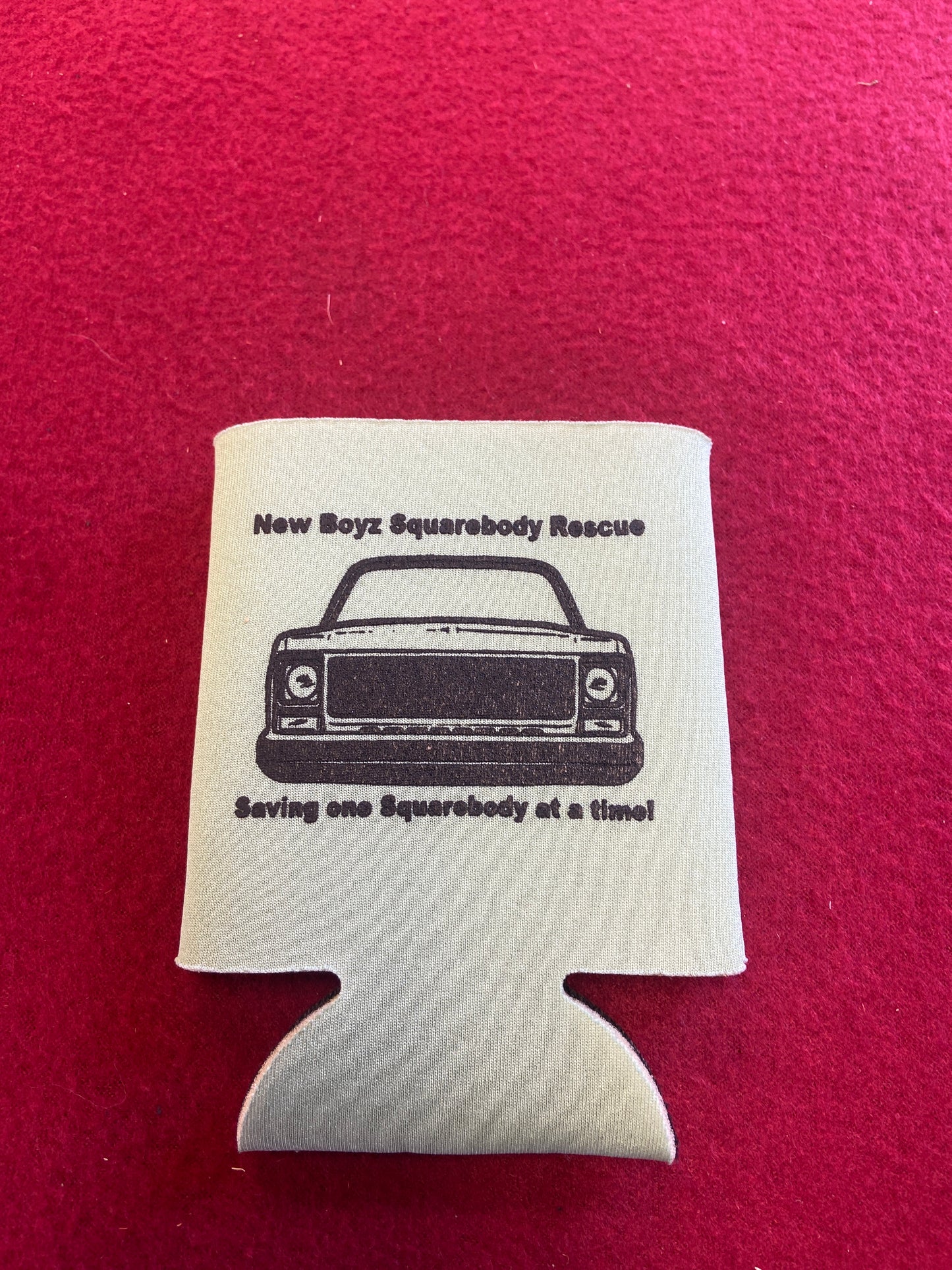 Koozie green with black logo